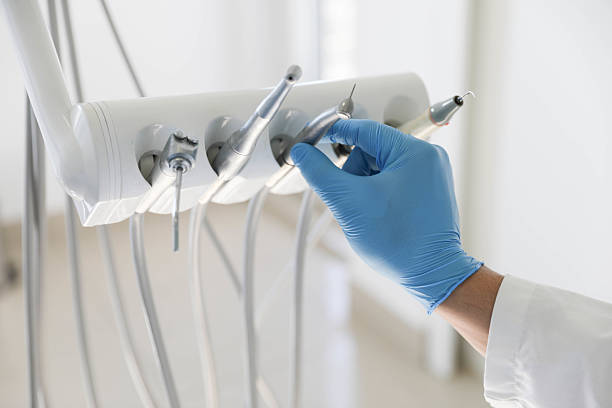 Professional Tooth Extraction technician working in Munford, AL